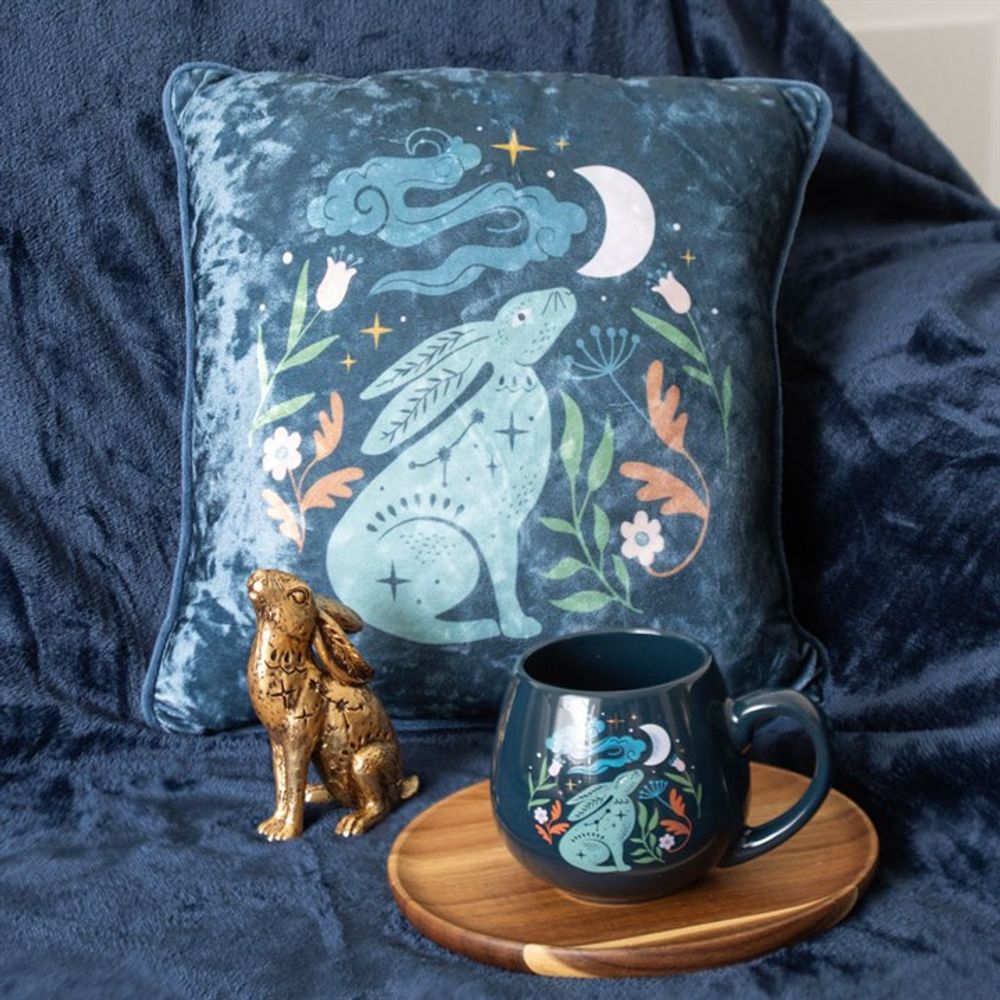 Beautiful soft midnight blue velvet cushion with a hare gazing up at the moon