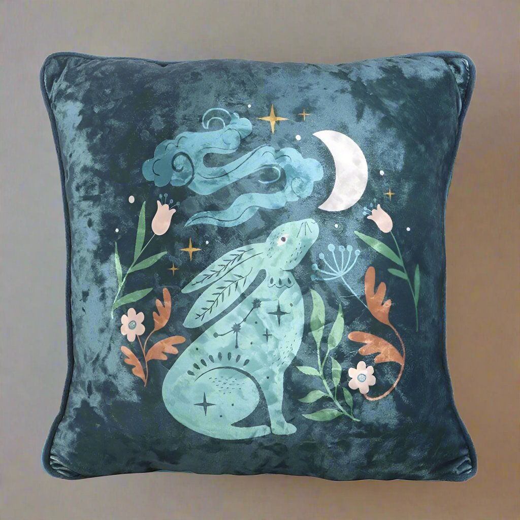 Square cushion with a velvety midnight blue scene with a hare staring up at the moon - base on the story 'love you to the moon and back'