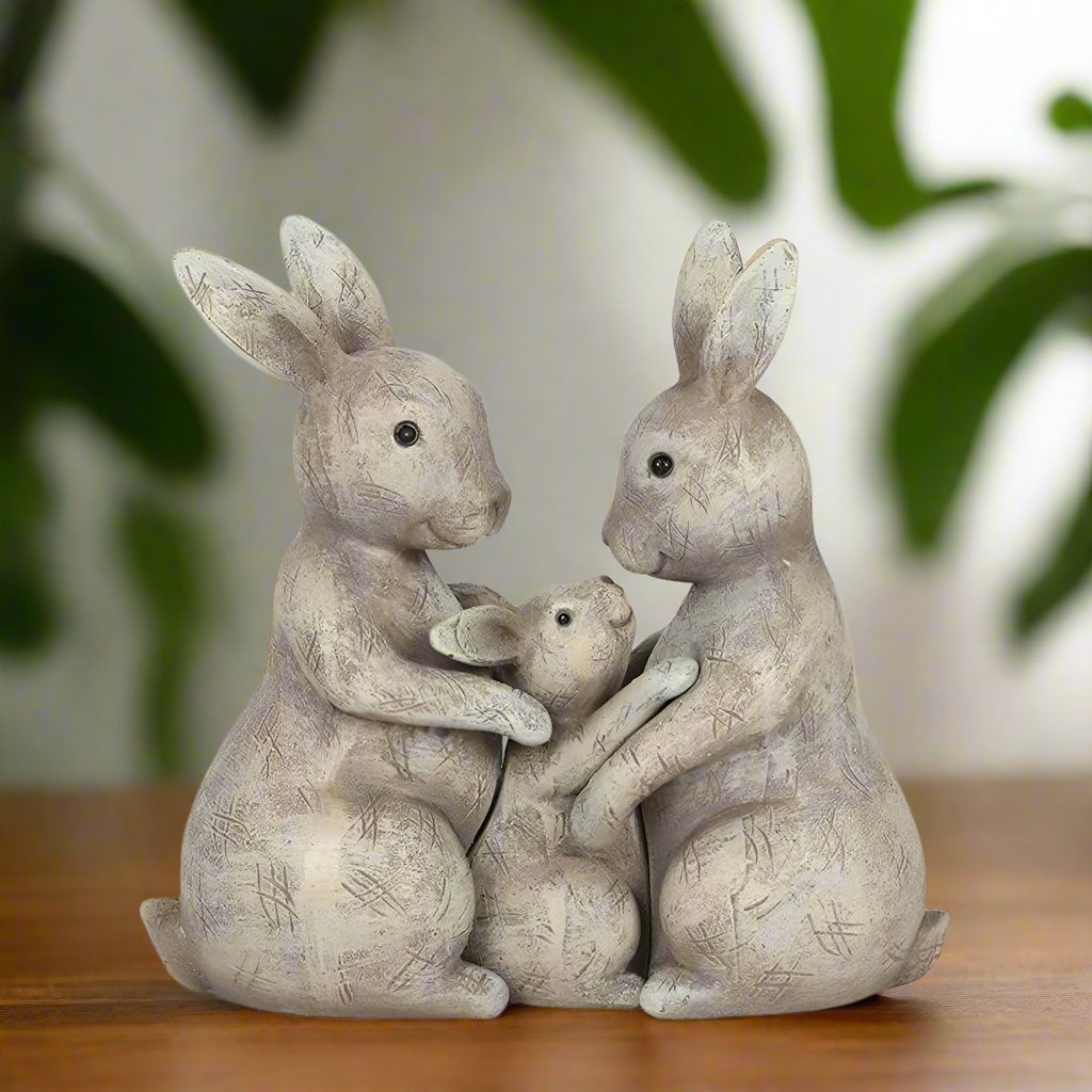 three bunnies ornament smiling and hugging